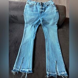 Anine Bing Light Blue Flare Jeans with slits in front.